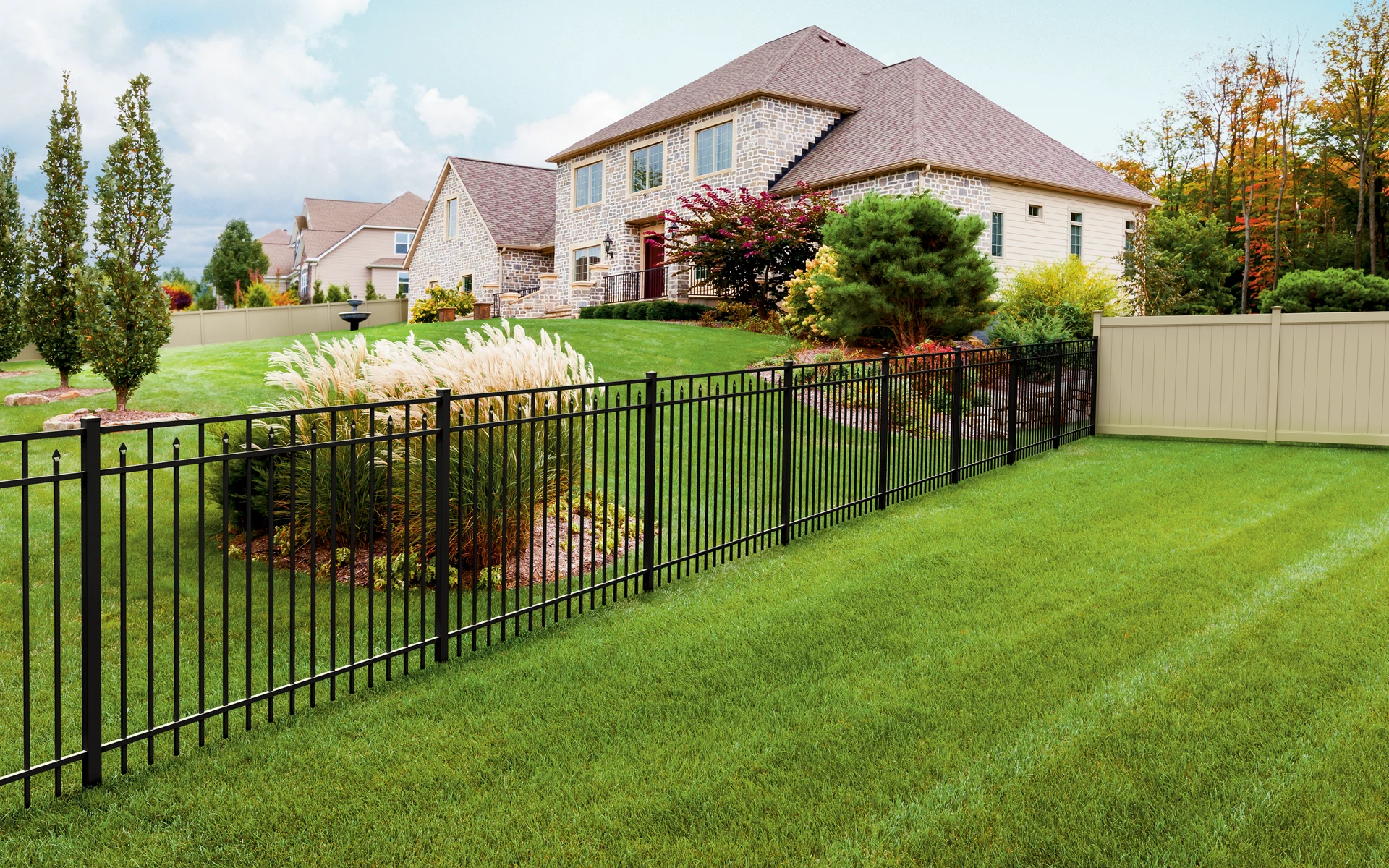Classic aluminum fence around suburban home